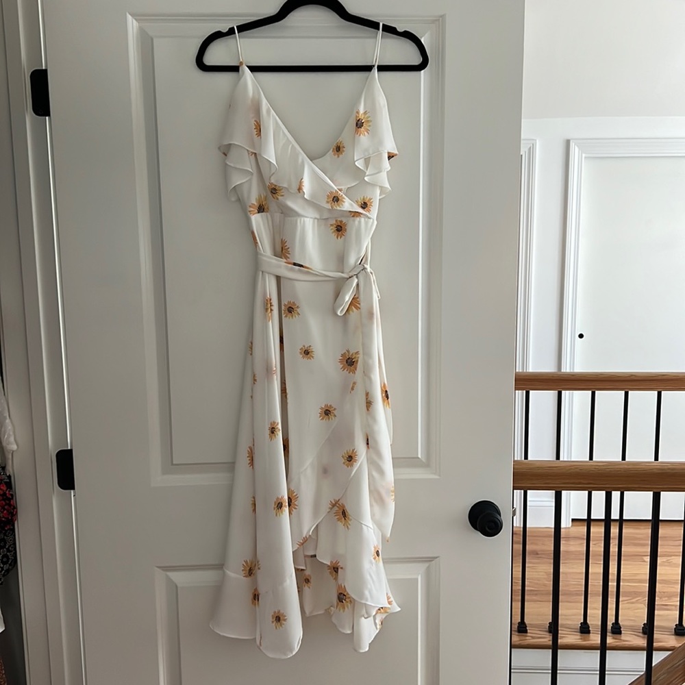 White flowy wrap dress with sunflowers